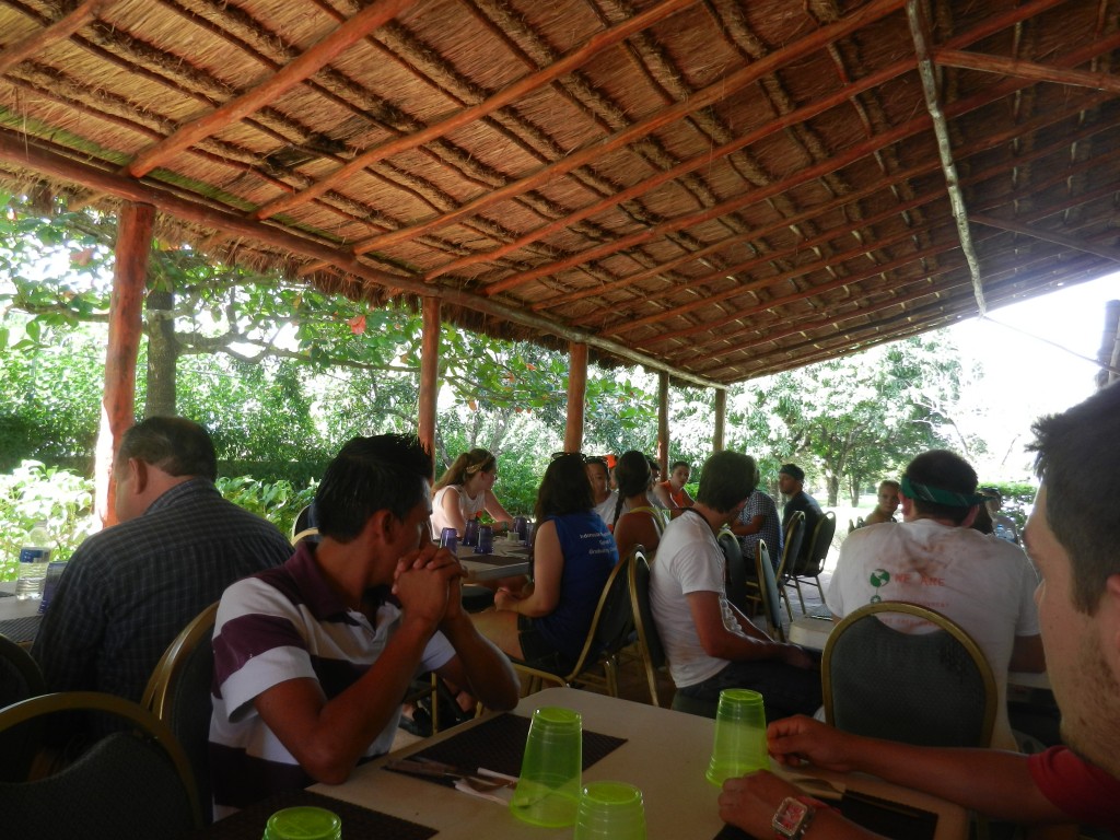 Students sit down to have lunch with the residents of Project Hombre, after completing their projects for the week.